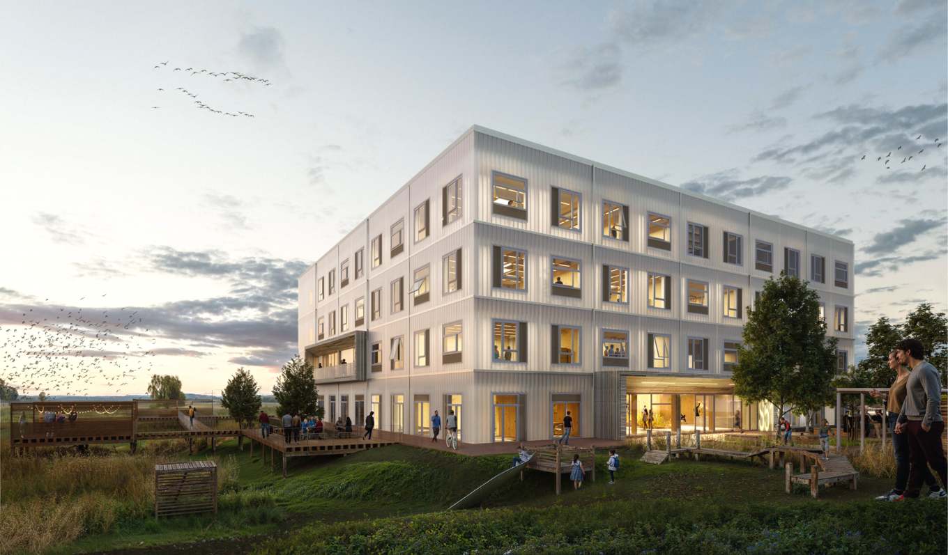 Ein würfelartiges Gebäude mit einer grünen Wiese | © BIS/Partner und Partner