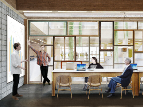 Ein Innenraum mit einem großen Holztisch und einer großen Leinwand, an der zwei Personen einen Vortrag halten | © BIS/Partner und Partner